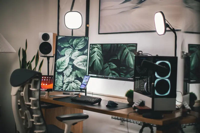Stylish gaming and streaming setup with dual monitors, PC, and accessories